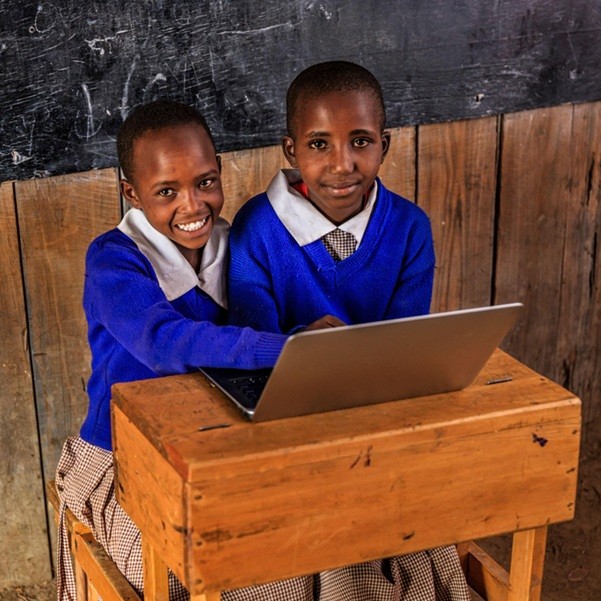 two poor girls sharing laptop